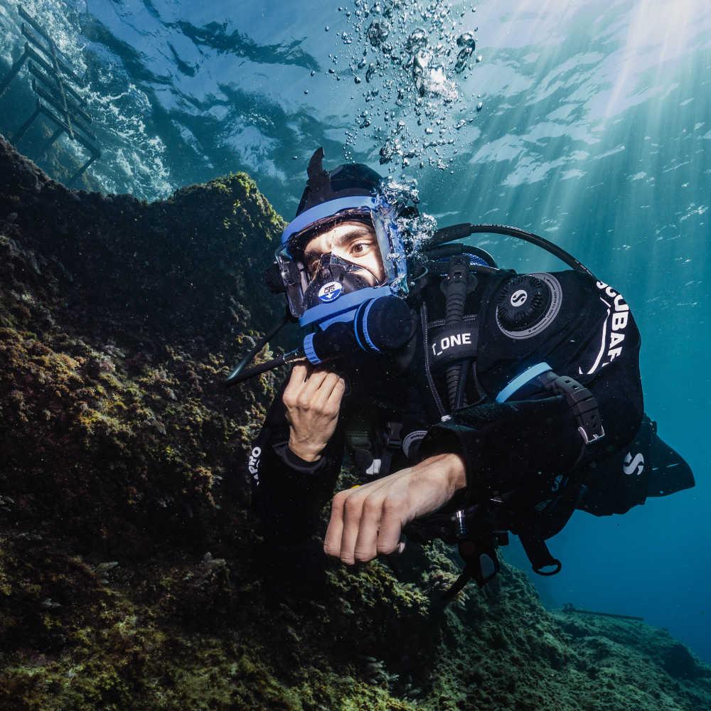 Diver close to a rocky reef